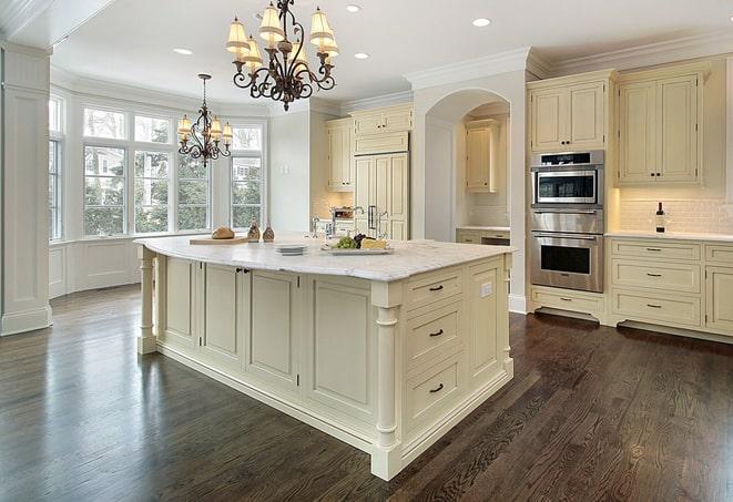 a modern kitchen with newly installed laminate flooring in Forest City FL